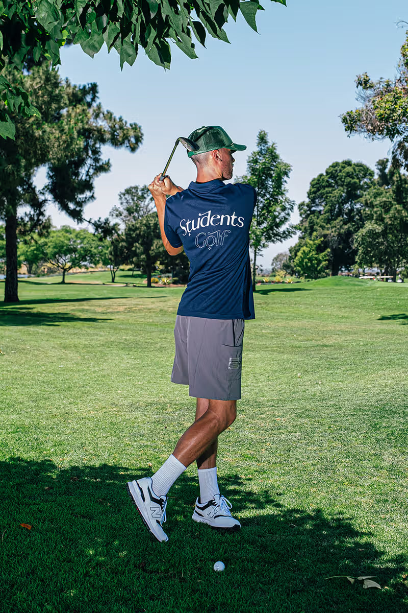 Students Golf clothing Canada — culture-forward golf apparel available at Gallery Streetwear, featuring stylish polos, relaxed-fit trousers, and modern golf lifestyle pieces
