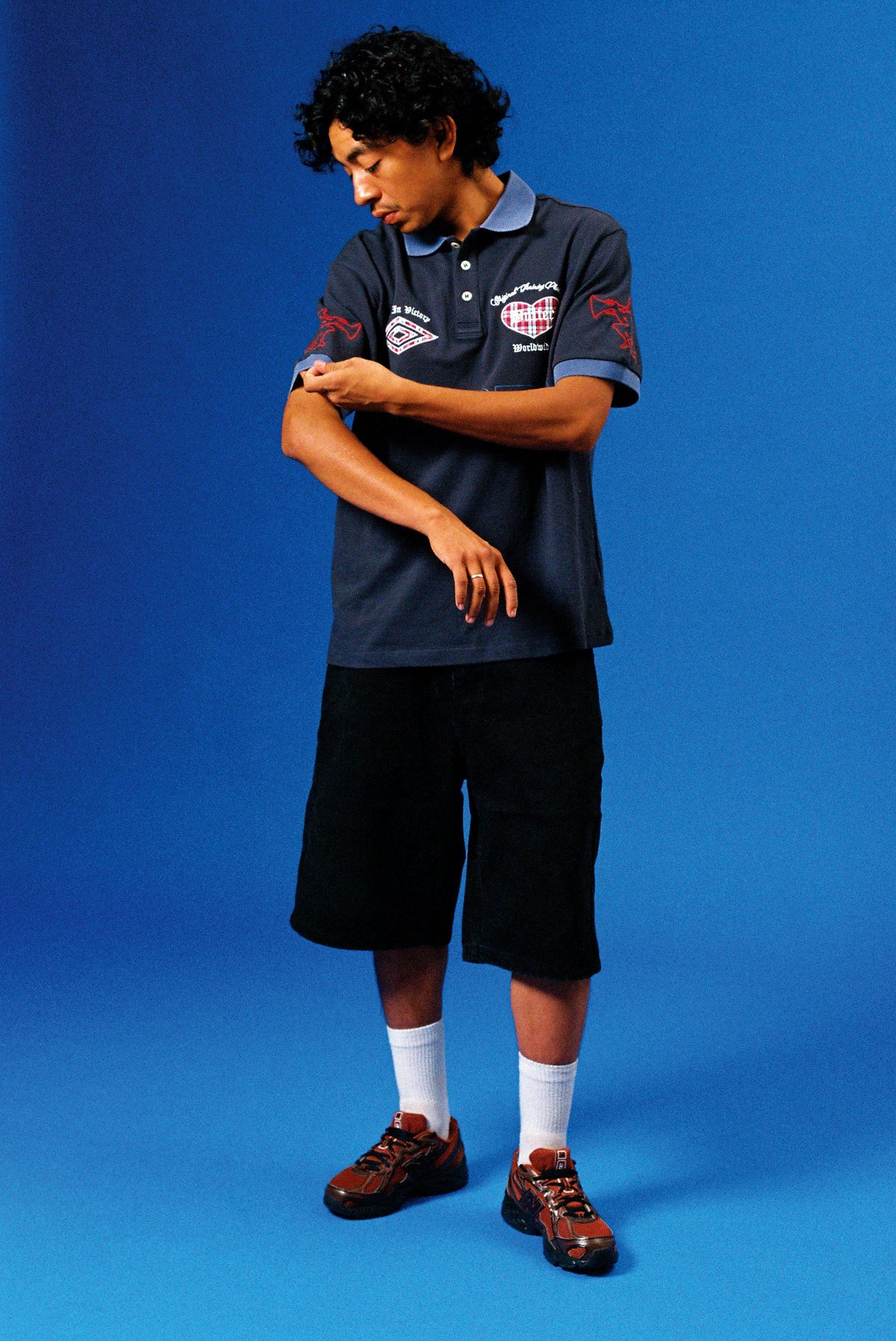 Butter Goods x Umbro Victory Polo Navy / Slate — worn by model