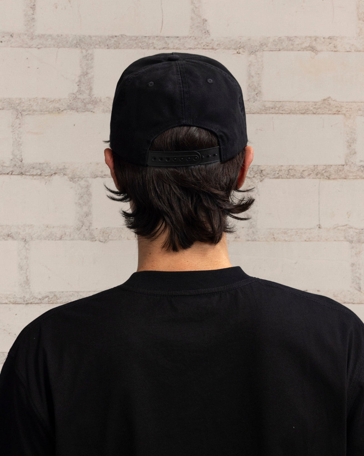 Pleasures Illegal Snapback Black — black cotton snapback cap worn on model, Gallery Streetwear Canada