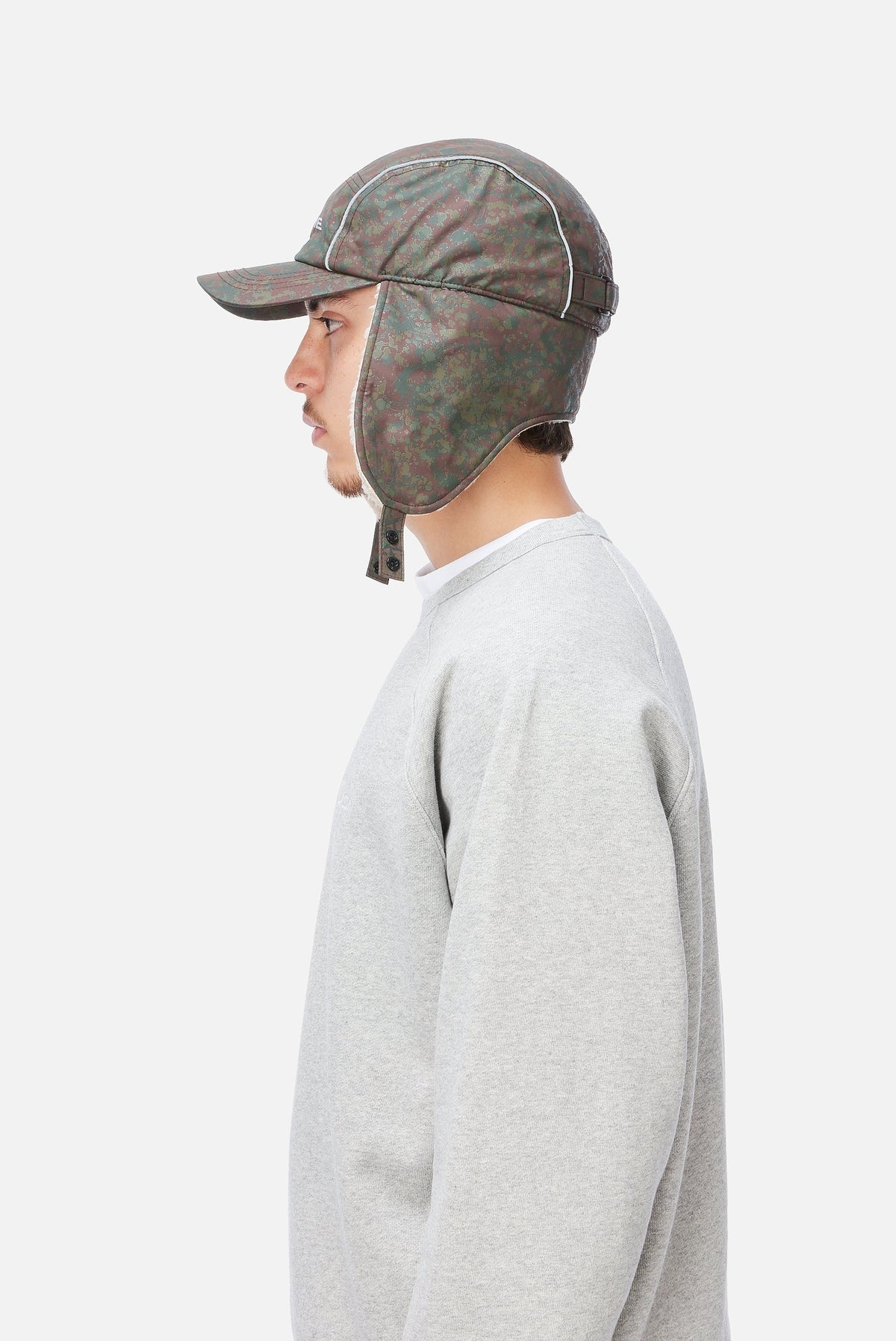 Dime MTL Hunter Earflap Cap Camo — worn by model
