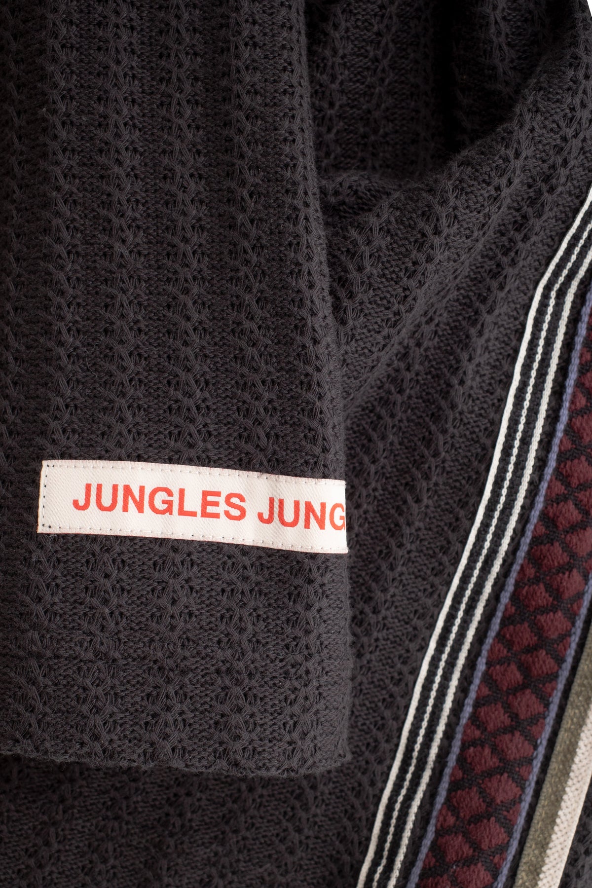 Jungles Jungles Triple Tape Knit black, lightweight knit fabric detail