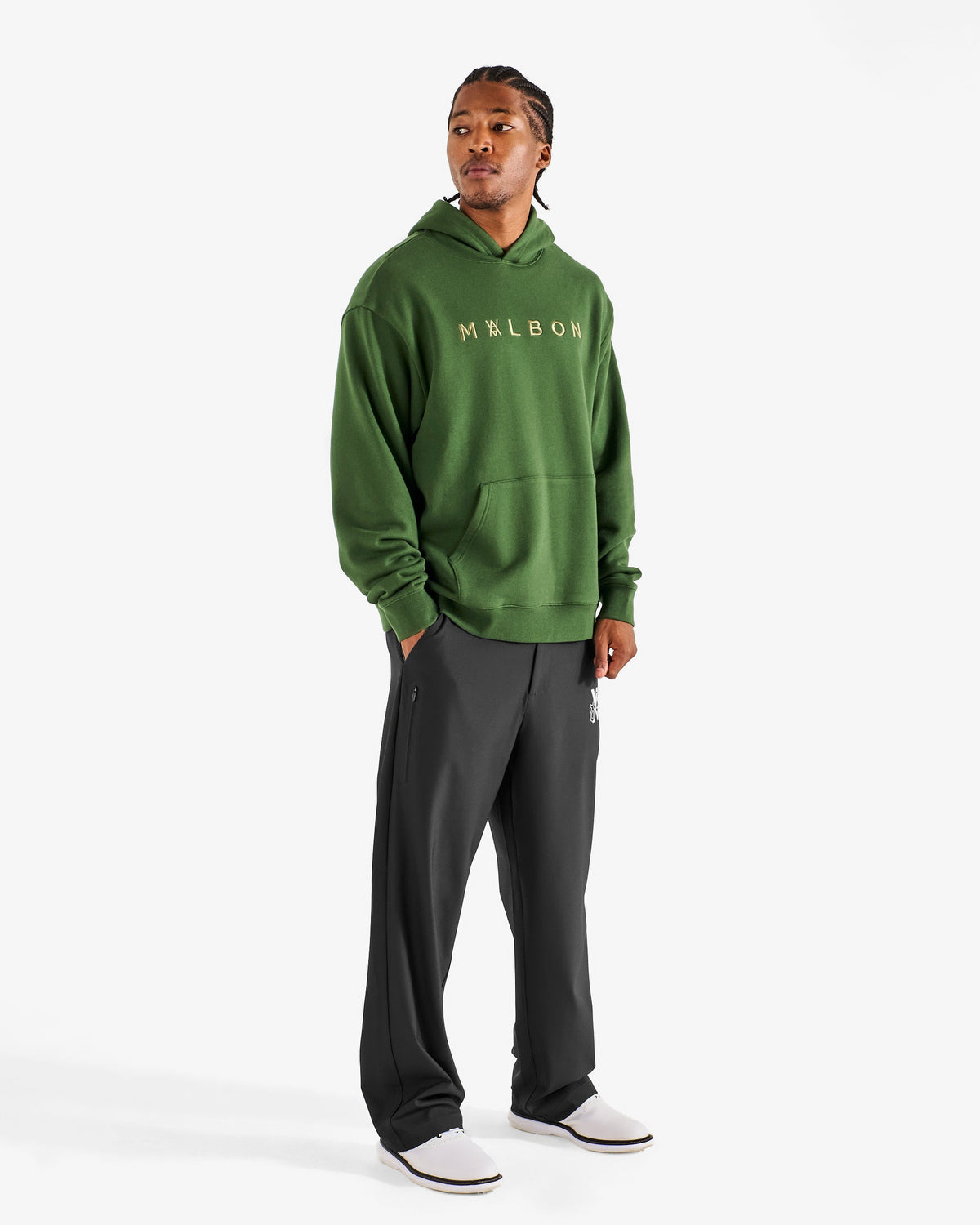 Malbon Golf x Daniel Arsham Shards Hoodie – Olive Stealth Camo worn on model — olive camo pullover hoodie with Arsham shards graphic, Gallery Streetwear Canada
