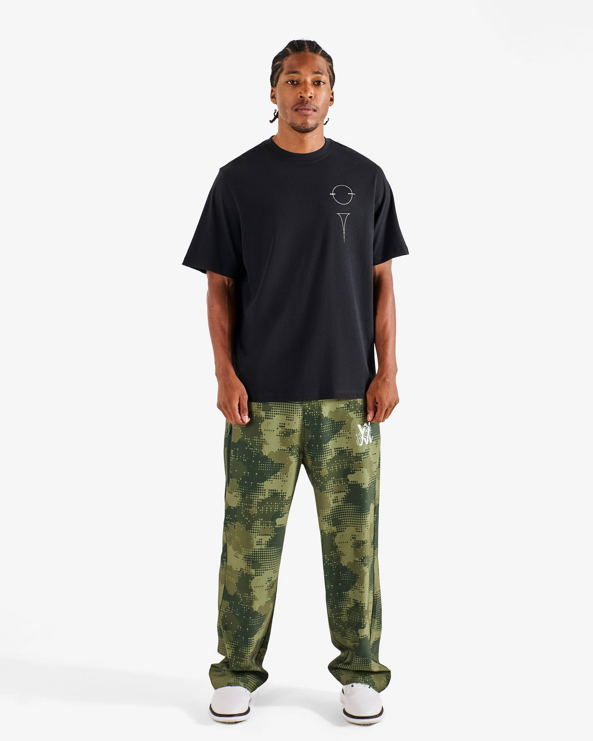 Malbon Golf x Daniel Arsham Bermuda Glyph Tee – Black worn on model — black cotton tee with Arsham glyph graphic, Gallery Streetwear Canada