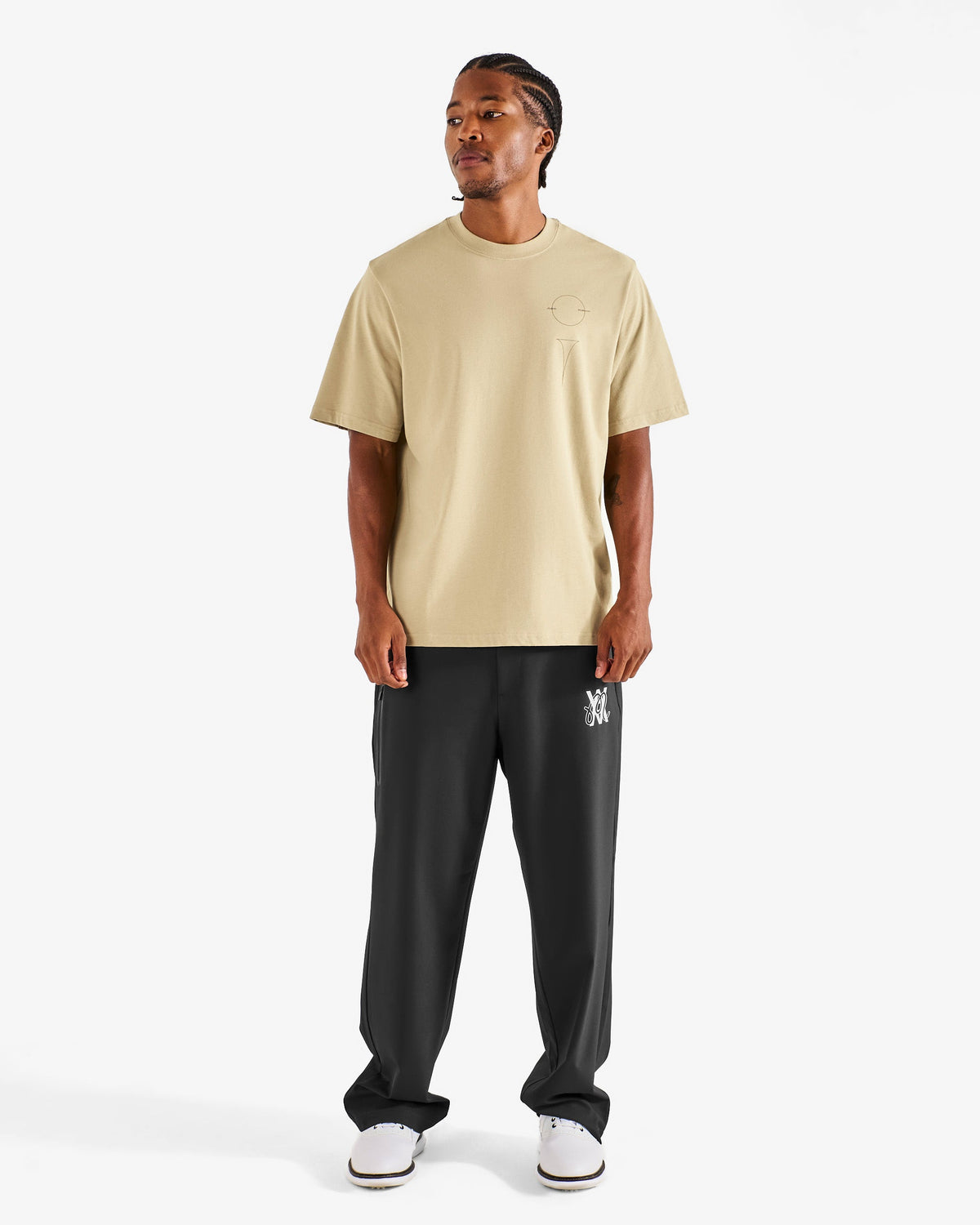 Malbon Golf x Daniel Arsham Bermuda Glyph Tee – Dune worn on model — beige cotton tee with Arsham glyph graphic, Gallery Streetwear Canada