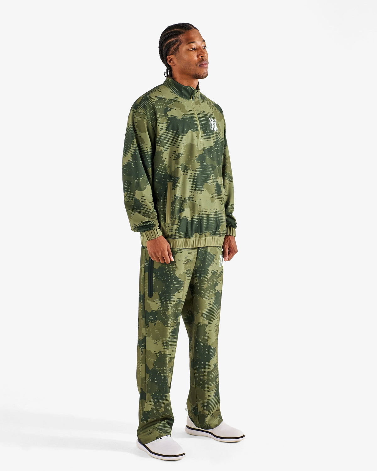 Malbon Golf x Daniel Arsham Stealth Pant – Olive Stealth Camo worn on model — olive camo golf pant, Gallery Streetwear Canada