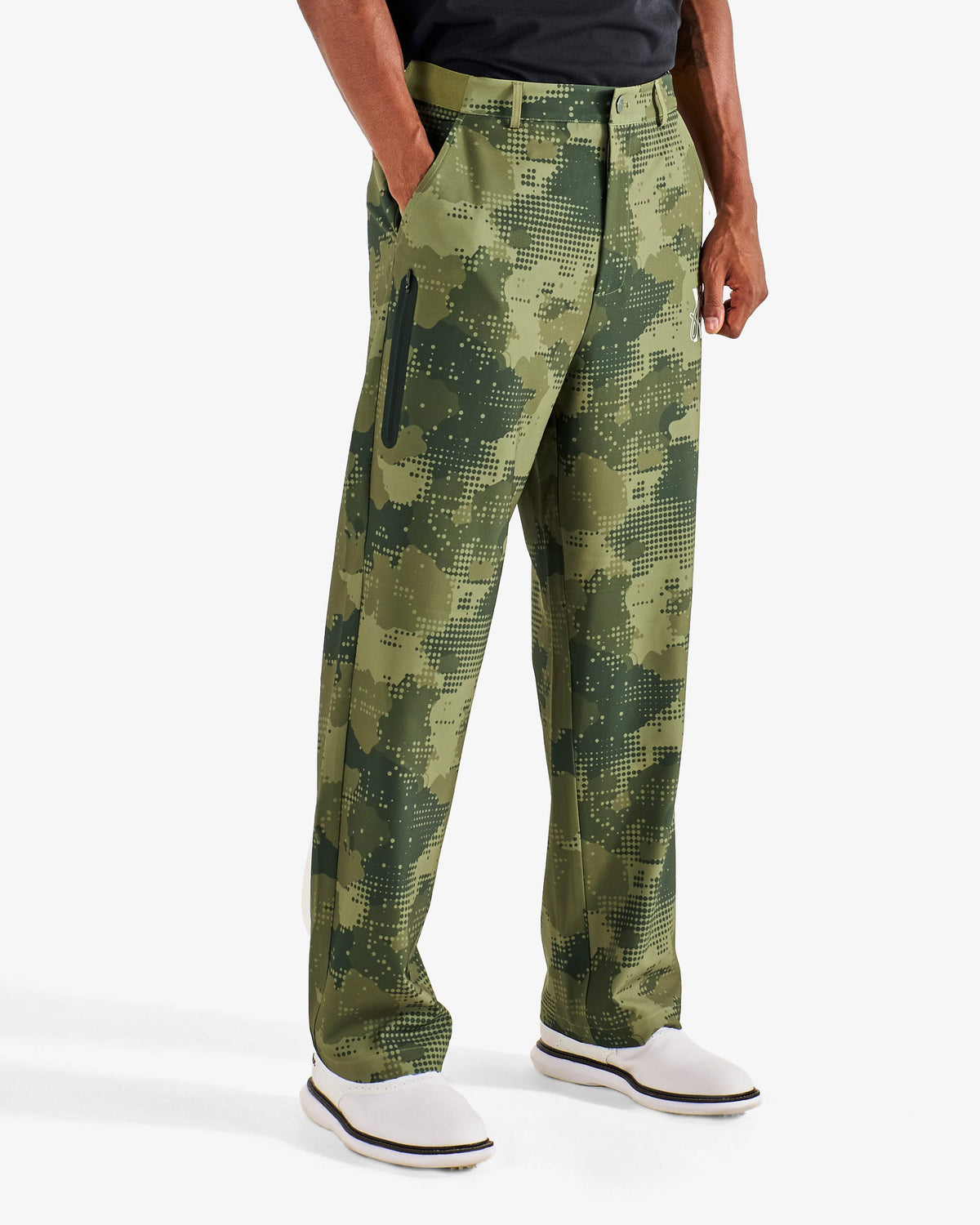 Malbon Golf x Daniel Arsham Stealth Pant – Olive Stealth Camo worn on model — olive camo golf pant, Gallery Streetwear Canada
