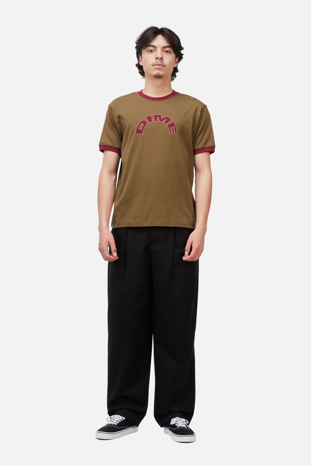 Model wearing the Dime MTL Arch Ringer T-Shirt in Brown, front view