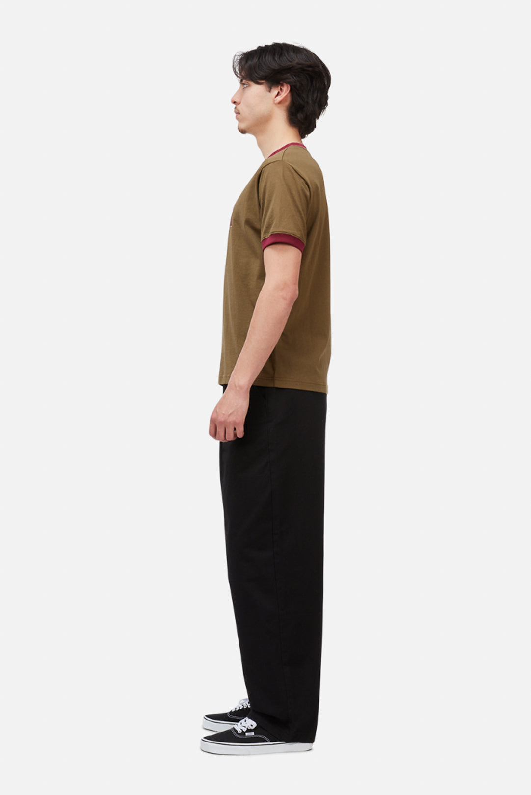 Model wearing the Dime MTL Arch Ringer T-Shirt in Brown, side view