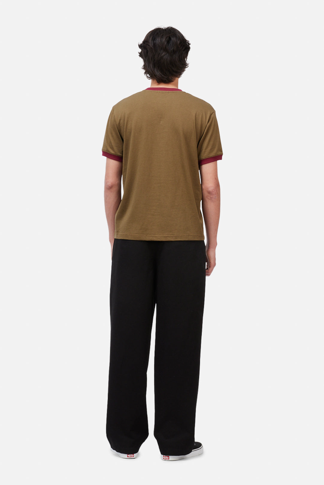 Model wearing the Dime MTL Arch Ringer T-Shirt in Brown, back view