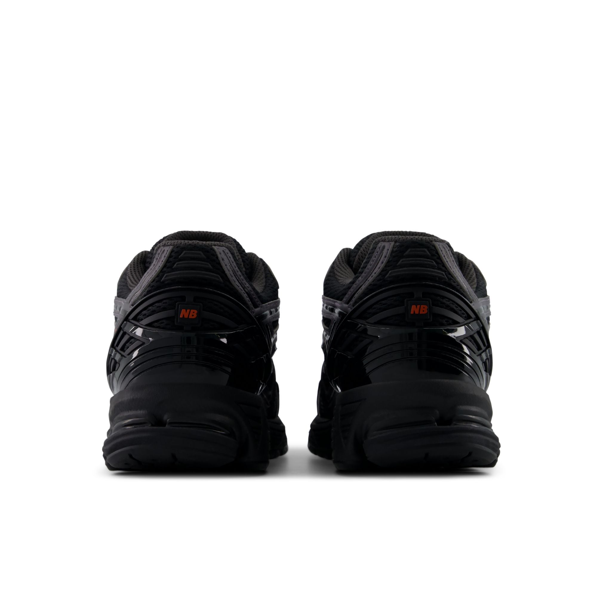 New Balance 1906R Black with Hot Tomato, heel and rear three-quarter view