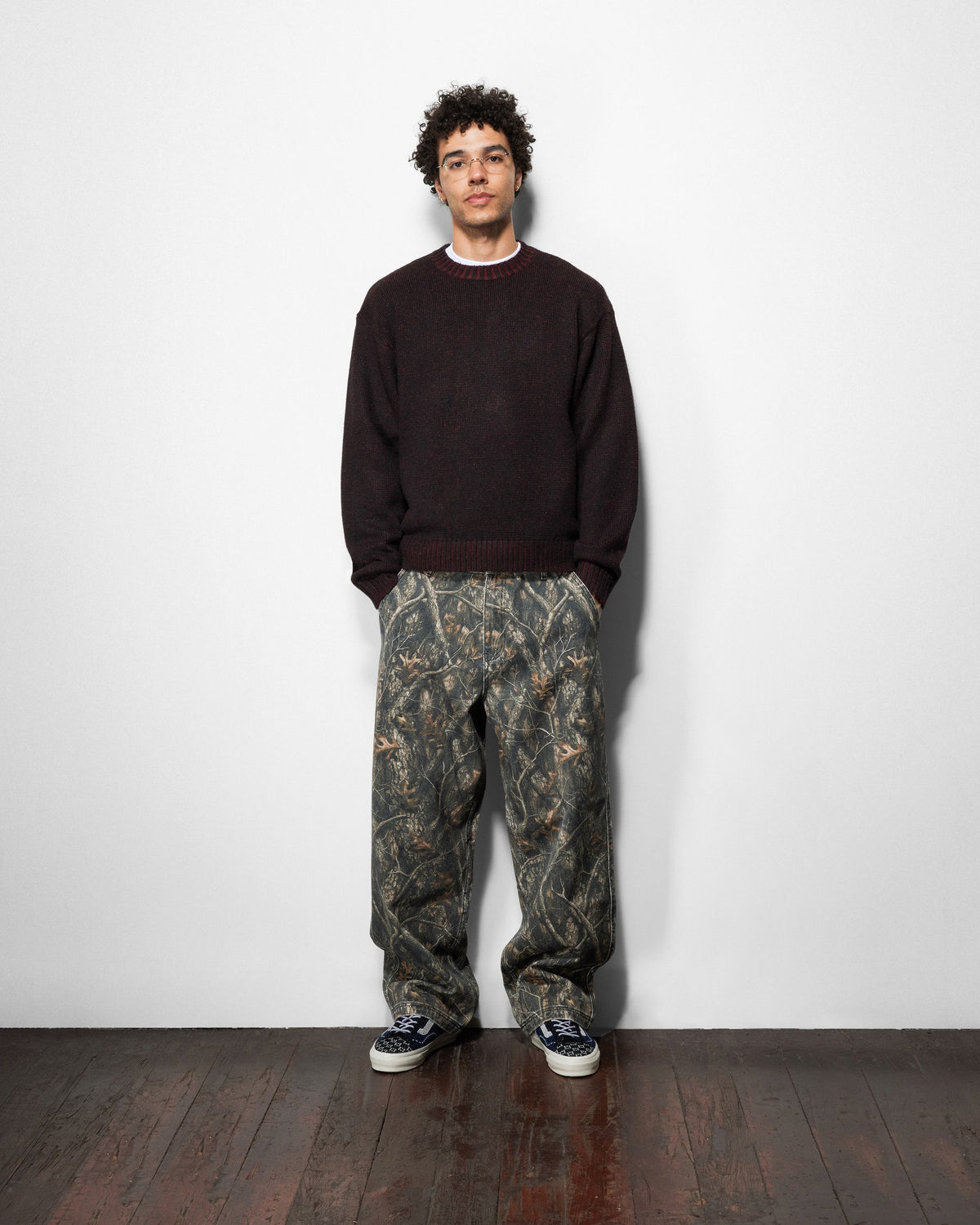 Butter Goods Work Pants in Forest Camo worn by a model
