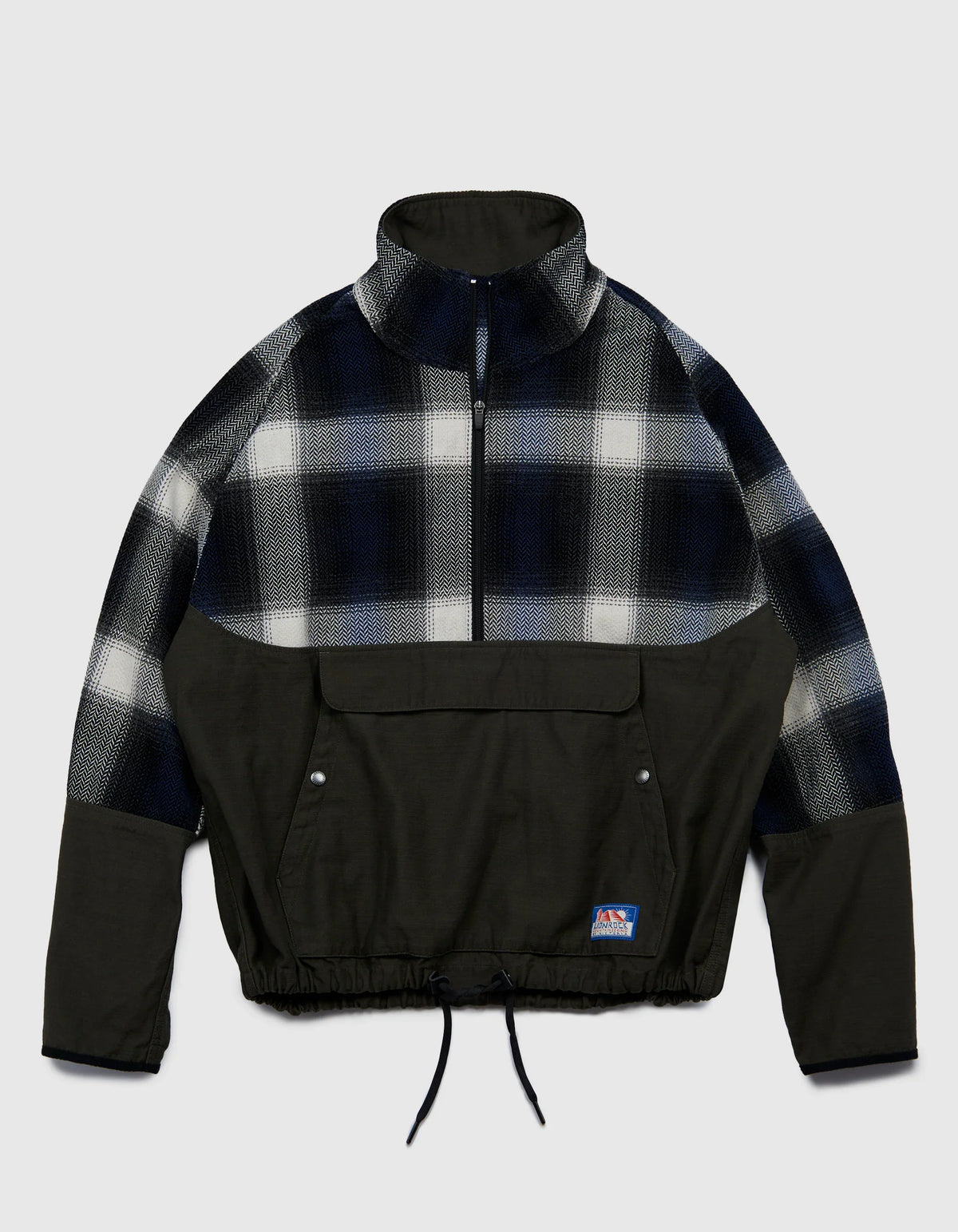Victoria HK Plaid Anorak in Cypress, the pullover plaid anorak that anchors the range — Victoria HK Fall Winter 2026 at Gallery Streetwear, Kelowna BC