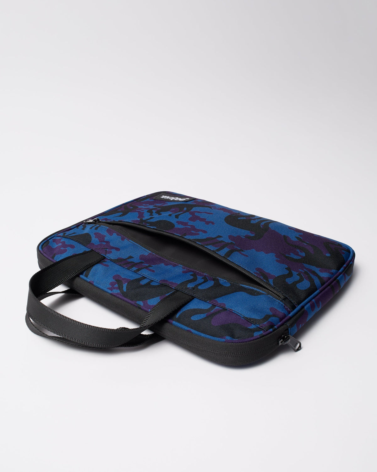 Parra Purple Camo Beast laptop sleeve — in use