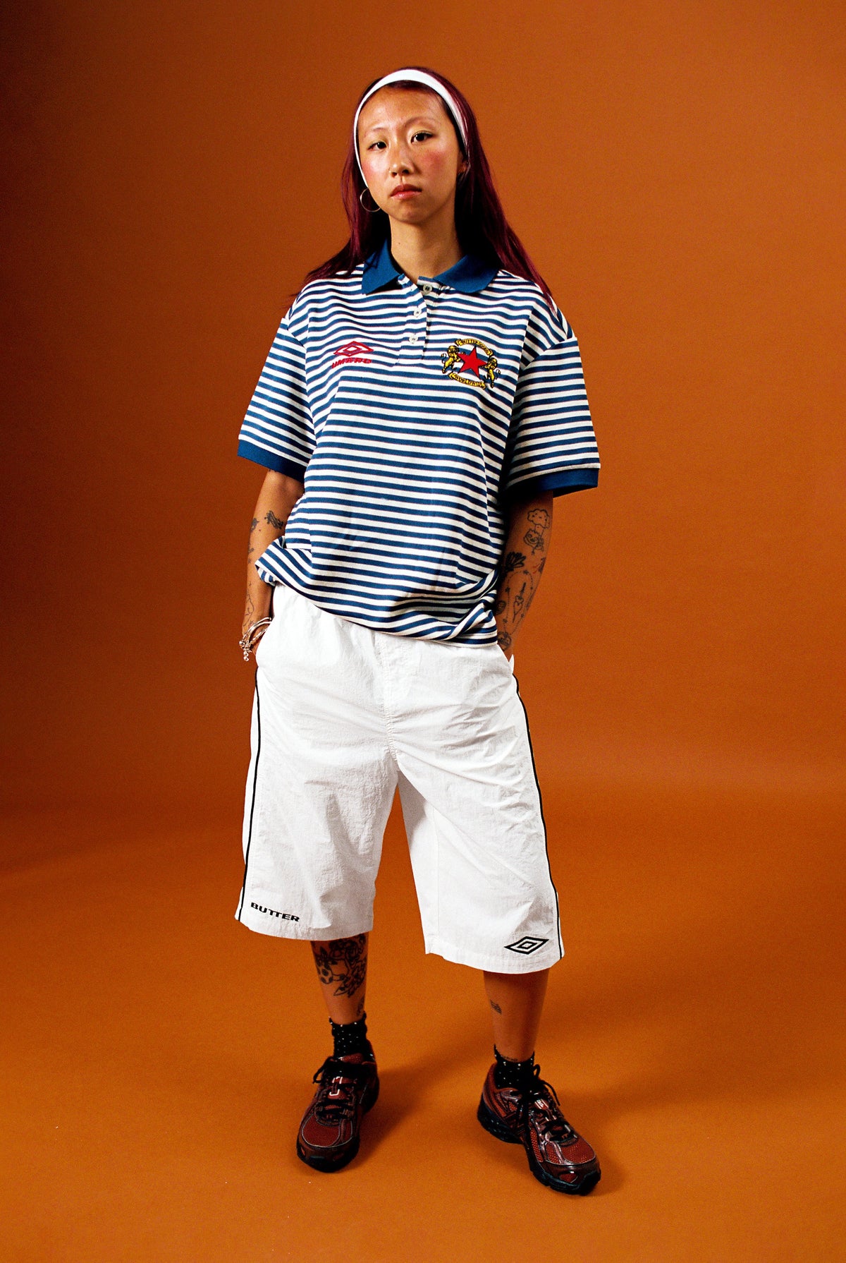 Butter Goods x Umbro Crest Polo Navy — worn by model