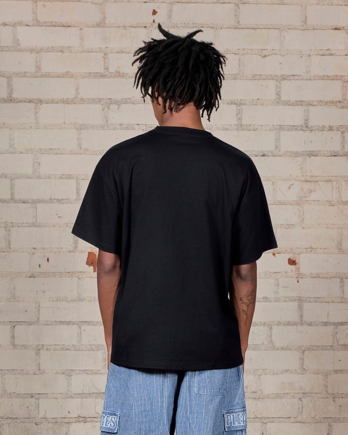 Pleasures End Times T-Shirt Black — black cotton t-shirt worn on model, Gallery Streetwear Canada