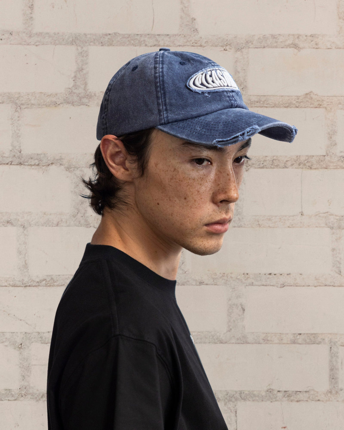 Pleasures Bubble Rip Cap Navy — navy cotton cap worn on model, Gallery Streetwear Canada