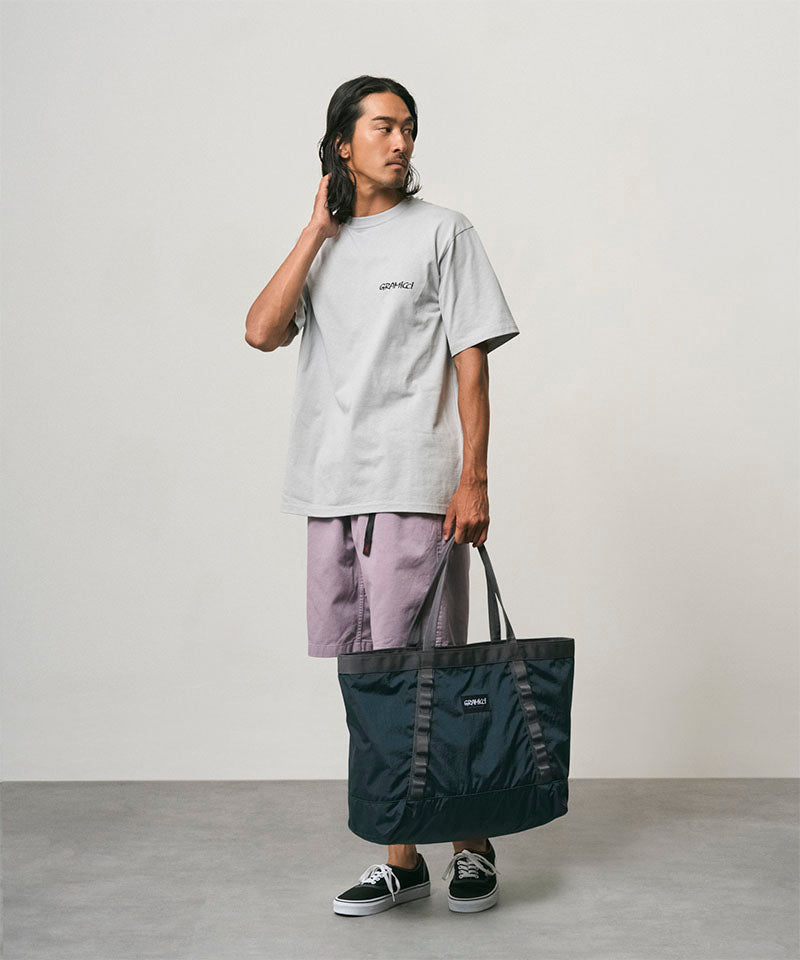 Gramicci Climbing Tote in Navy, carried on shoulder