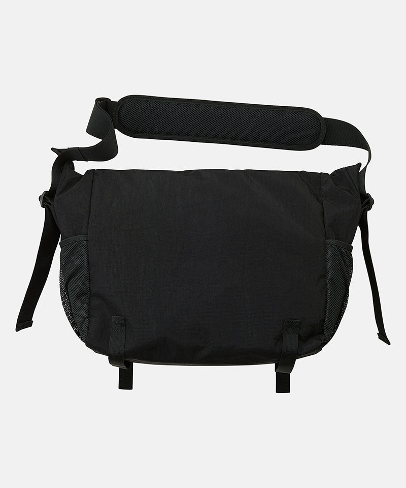 Gramicci Messenger Bag in Black, worn crossbody
