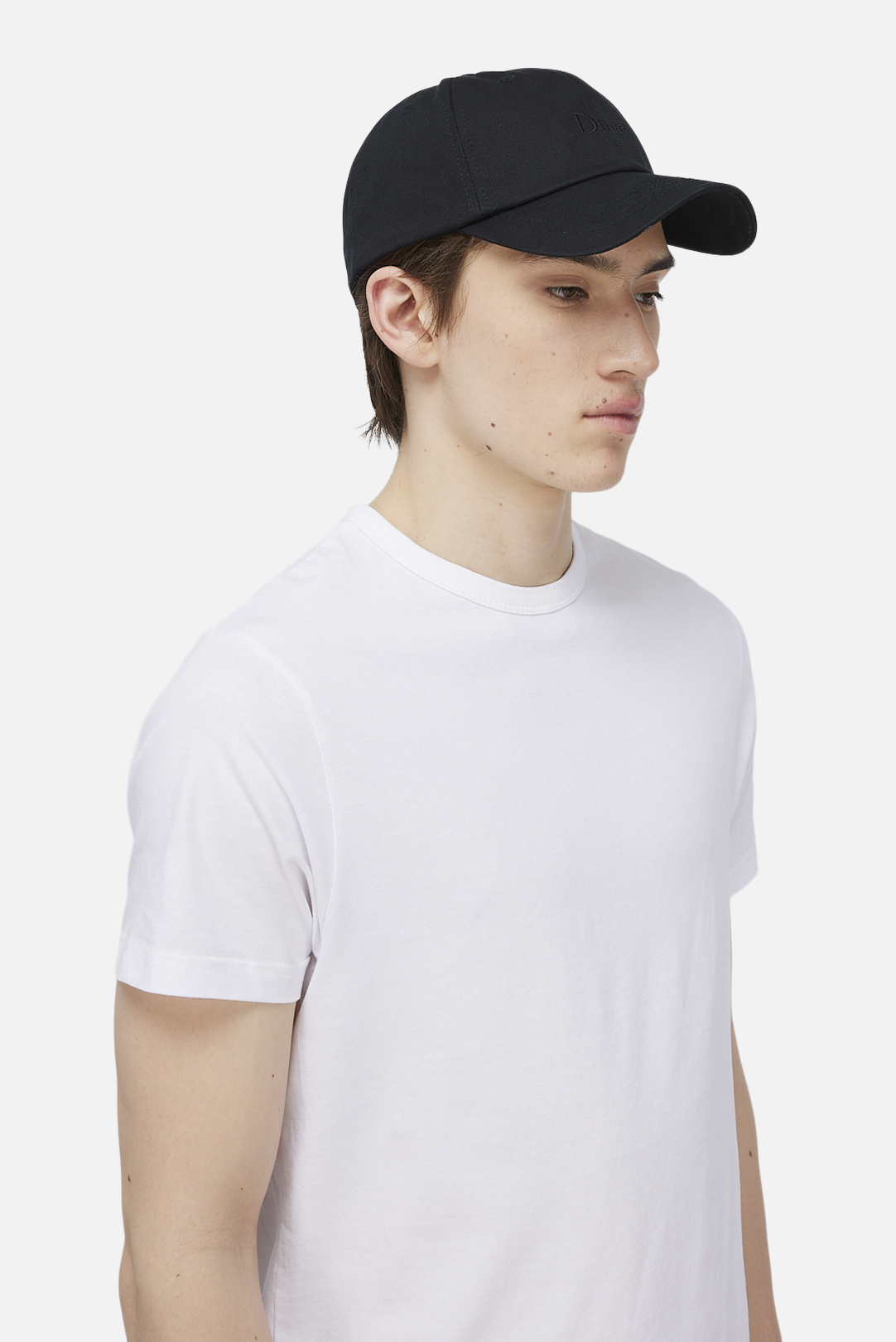 Model wearing the Dime MTL Classic Low Pro Cap in Black, side view