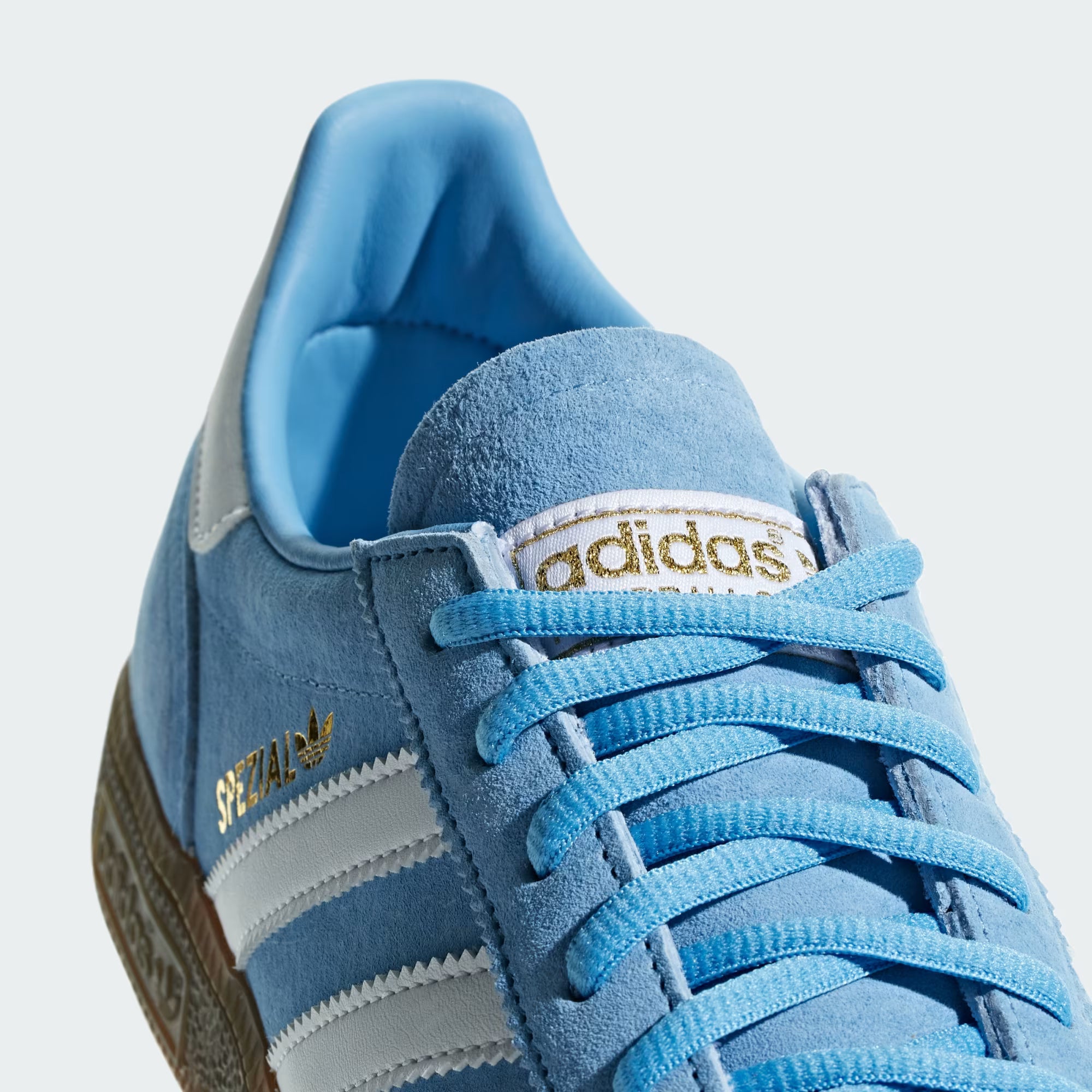 Adidas Handball Spezial — Light Blue / Cloud White tongue detail on shoes