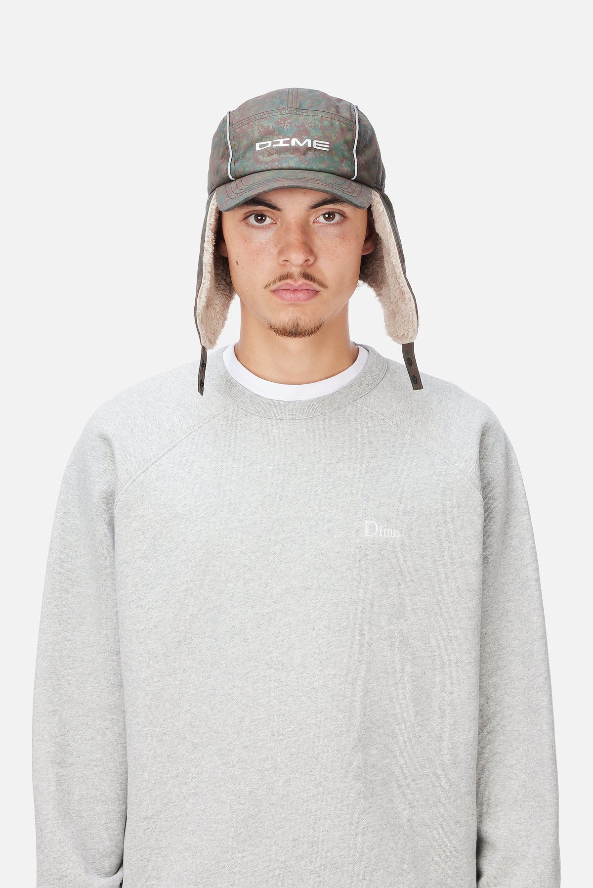 Dime MTL Hunter Earflap Cap Camo — worn by model