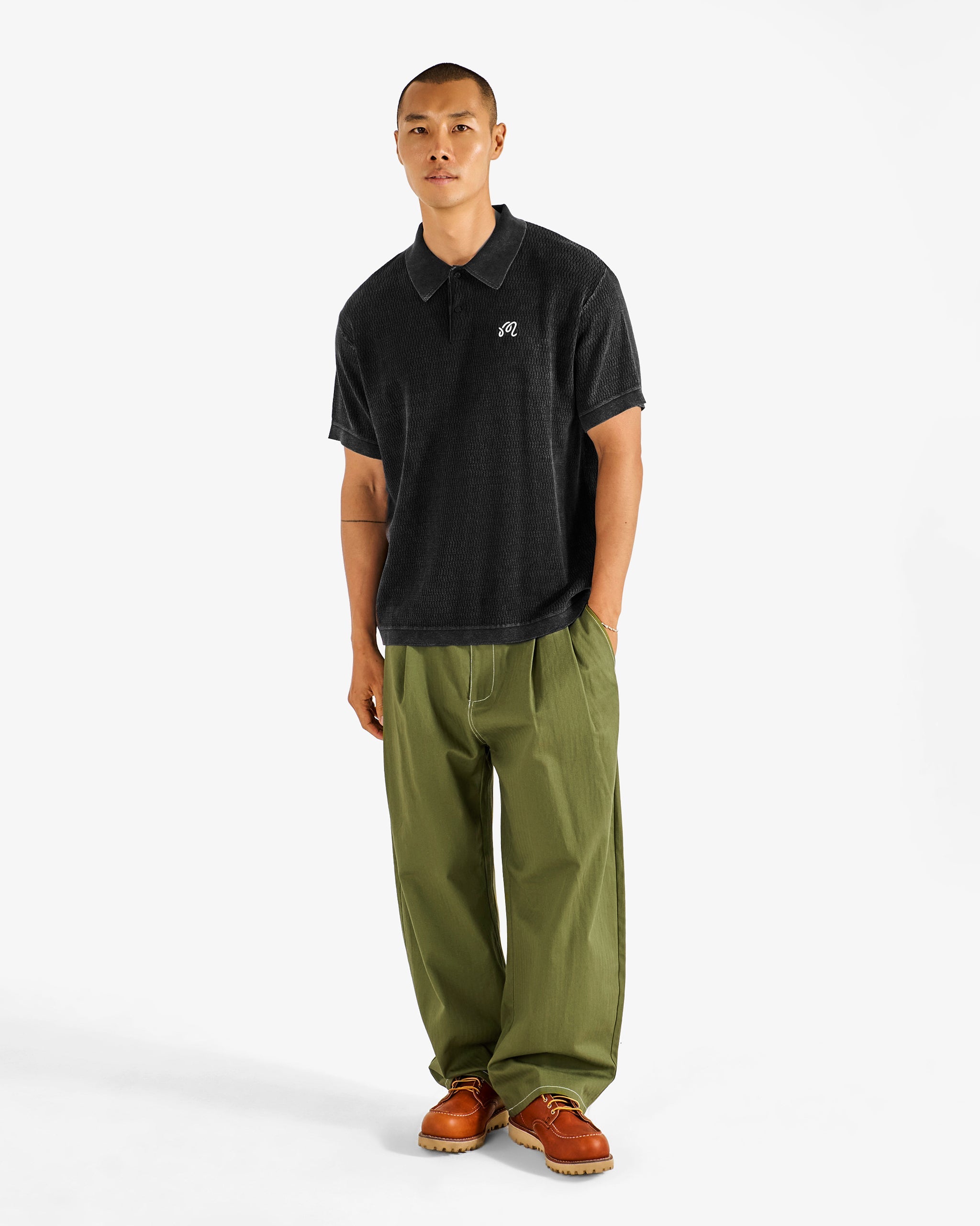Malbon Golf Brickwork Polo black worn on model — course-to-clubhouse golf polo, Gallery Streetwear Kelowna