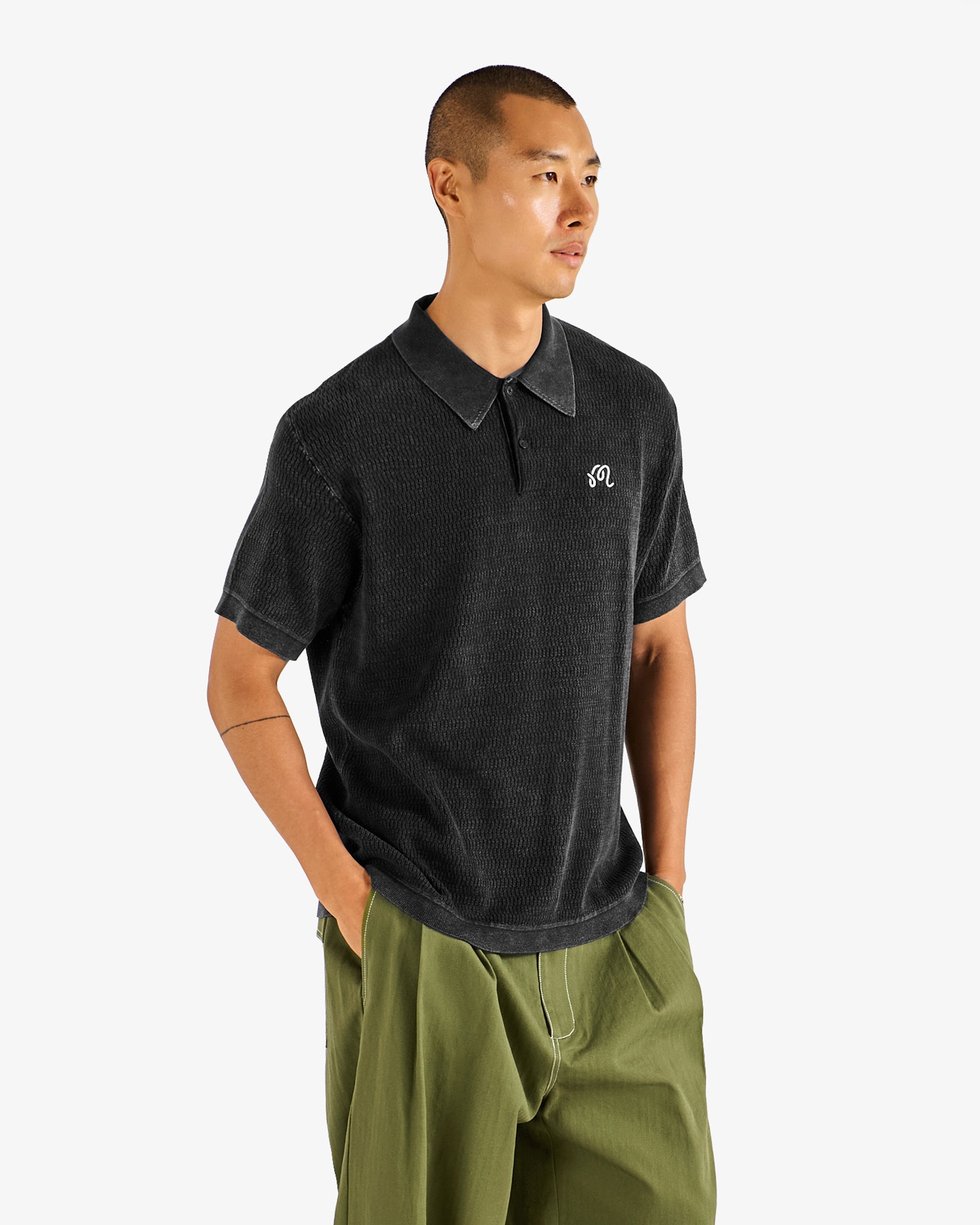 Malbon Golf Brickwork Polo black — open-knit texture and ribbed trim detail