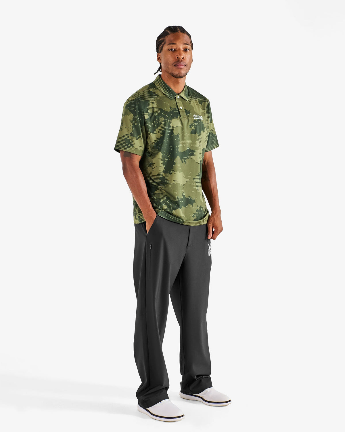 Malbon Golf x Daniel Arsham Fairway Stealth Polo – Olive Stealth Camo worn on model — olive dotted-camo golf polo, Gallery Streetwear Canada