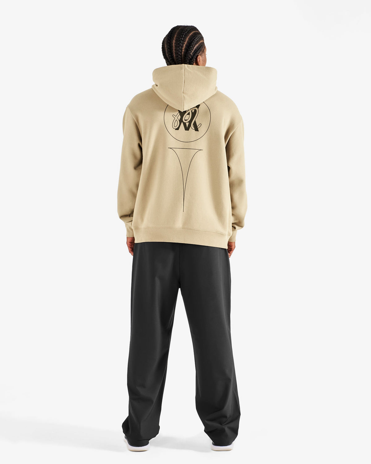 Malbon Golf x Daniel Arsham Shards Hoodie – Dune worn on model — beige pullover hoodie with Arsham shards graphic, Gallery Streetwear Canada