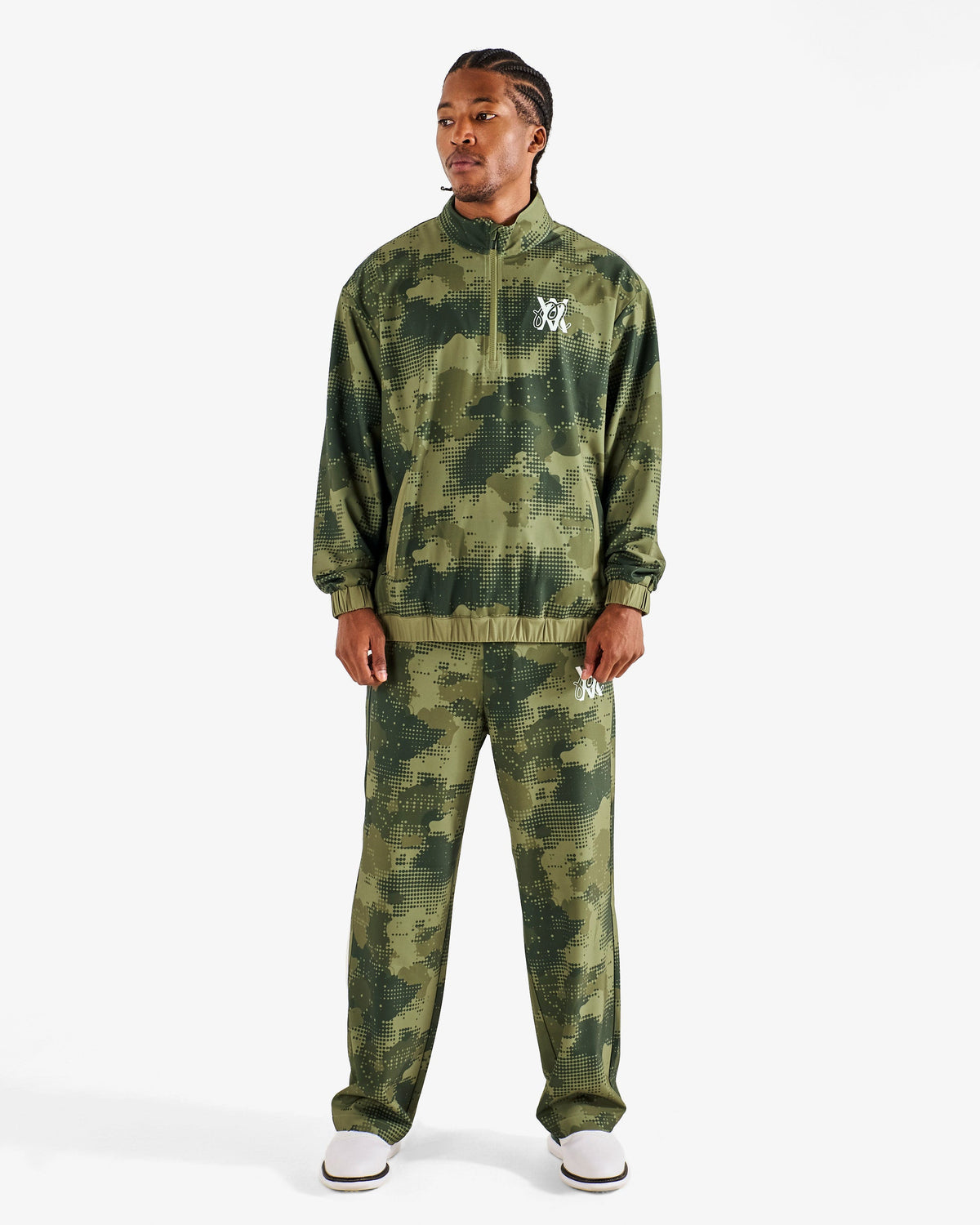 Malbon Golf x Daniel Arsham Stealth Pant – Olive Stealth Camo worn on model — olive camo golf pant, Gallery Streetwear Canada