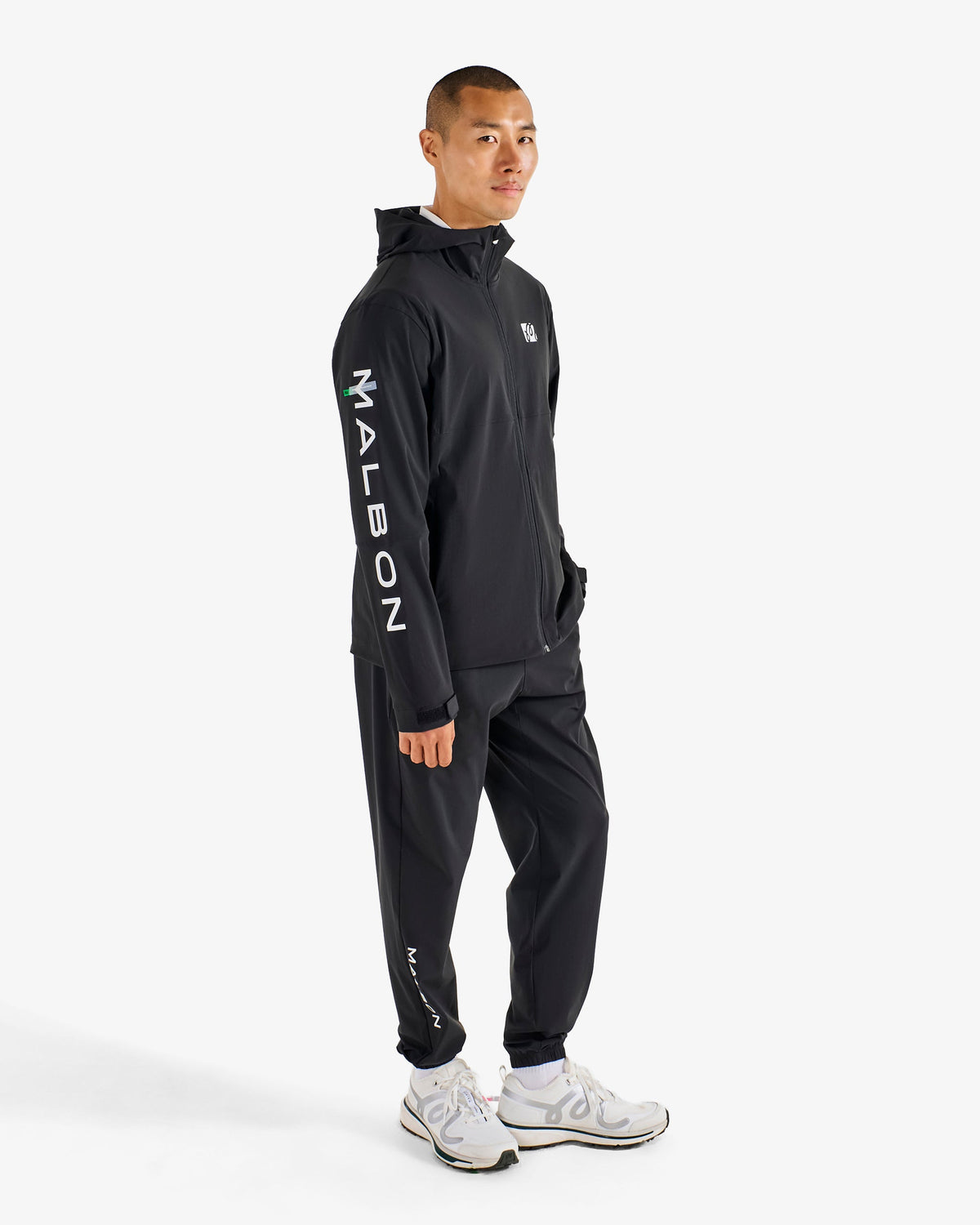 Malbon Golf Performance Shell Jacket black, side pockets and sleeve