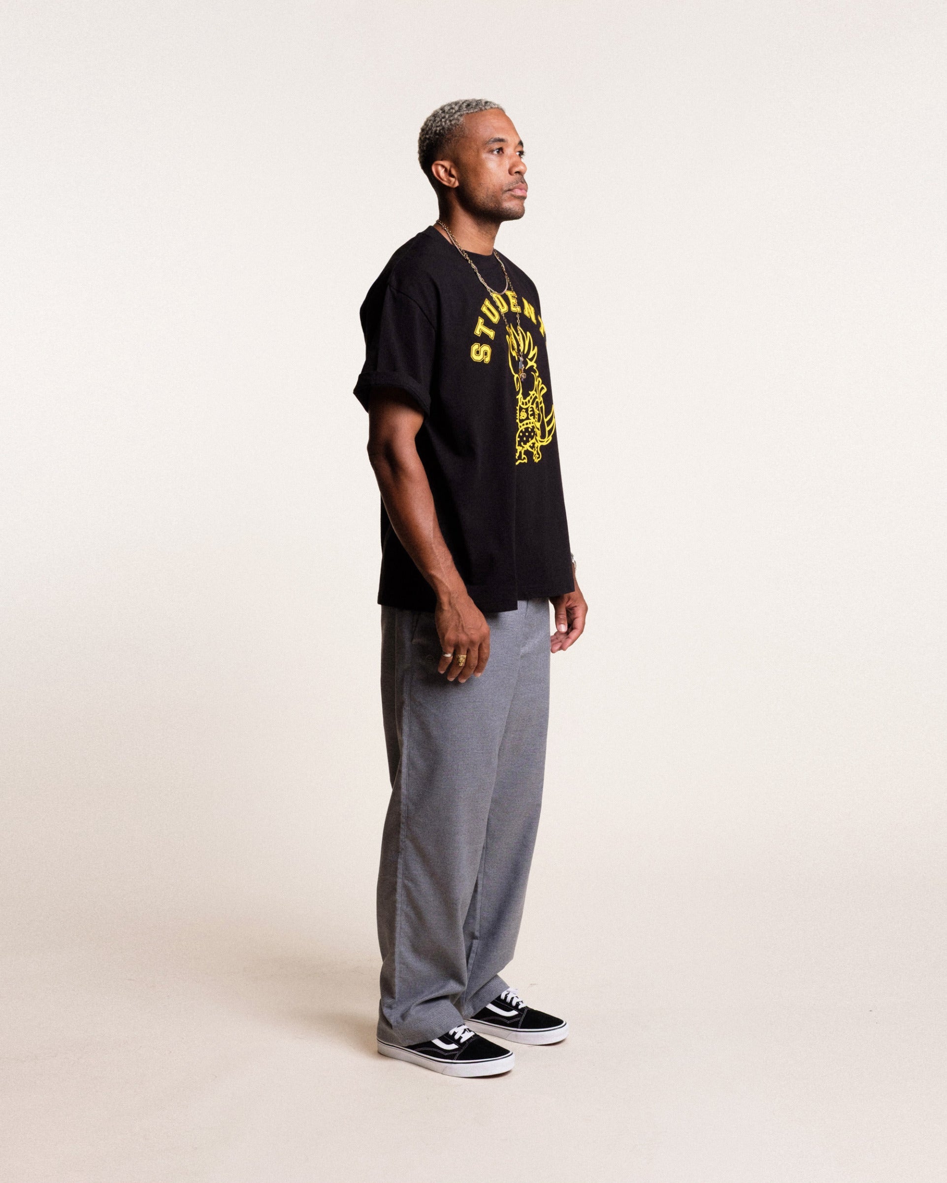 Students Golf Chippy black t-shirt side view on model