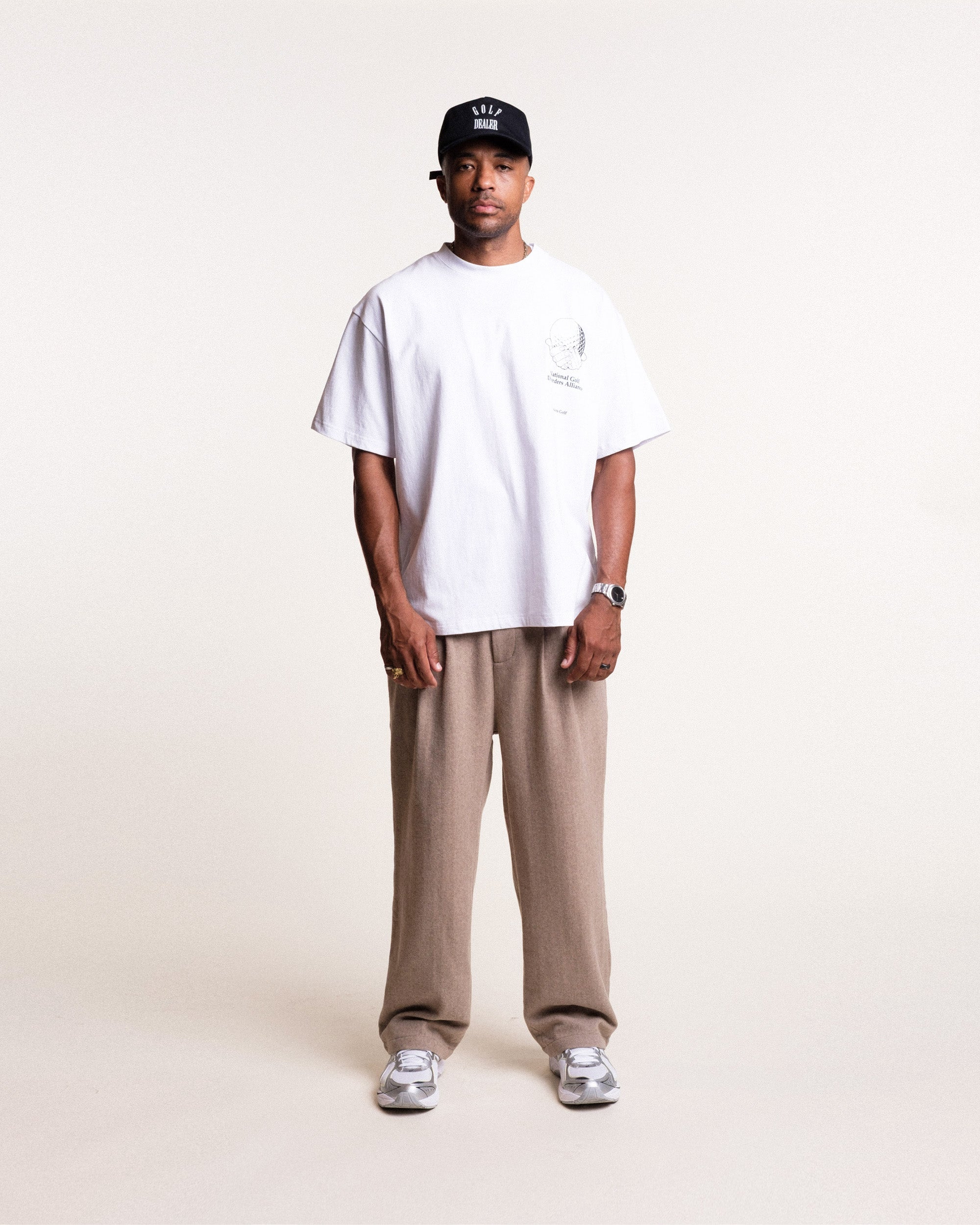 Model wearing Students Golf National Golf Disorders white t-shirt