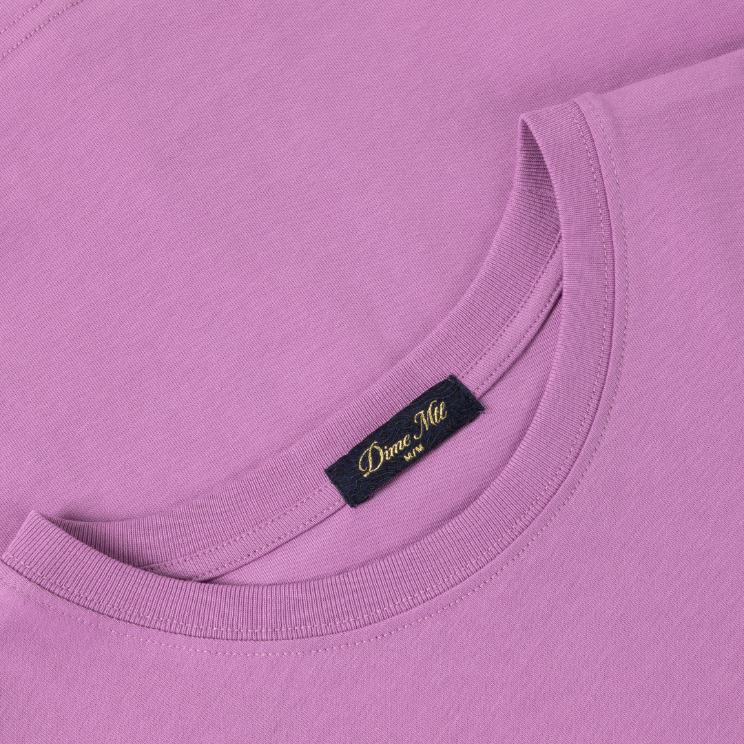 Detail of the cursive paper cut graphic on the Lilac T-Shirt