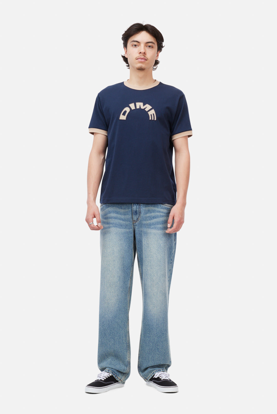 Model wearing the Dime MTL Arch Ringer T-Shirt in Navy, front view