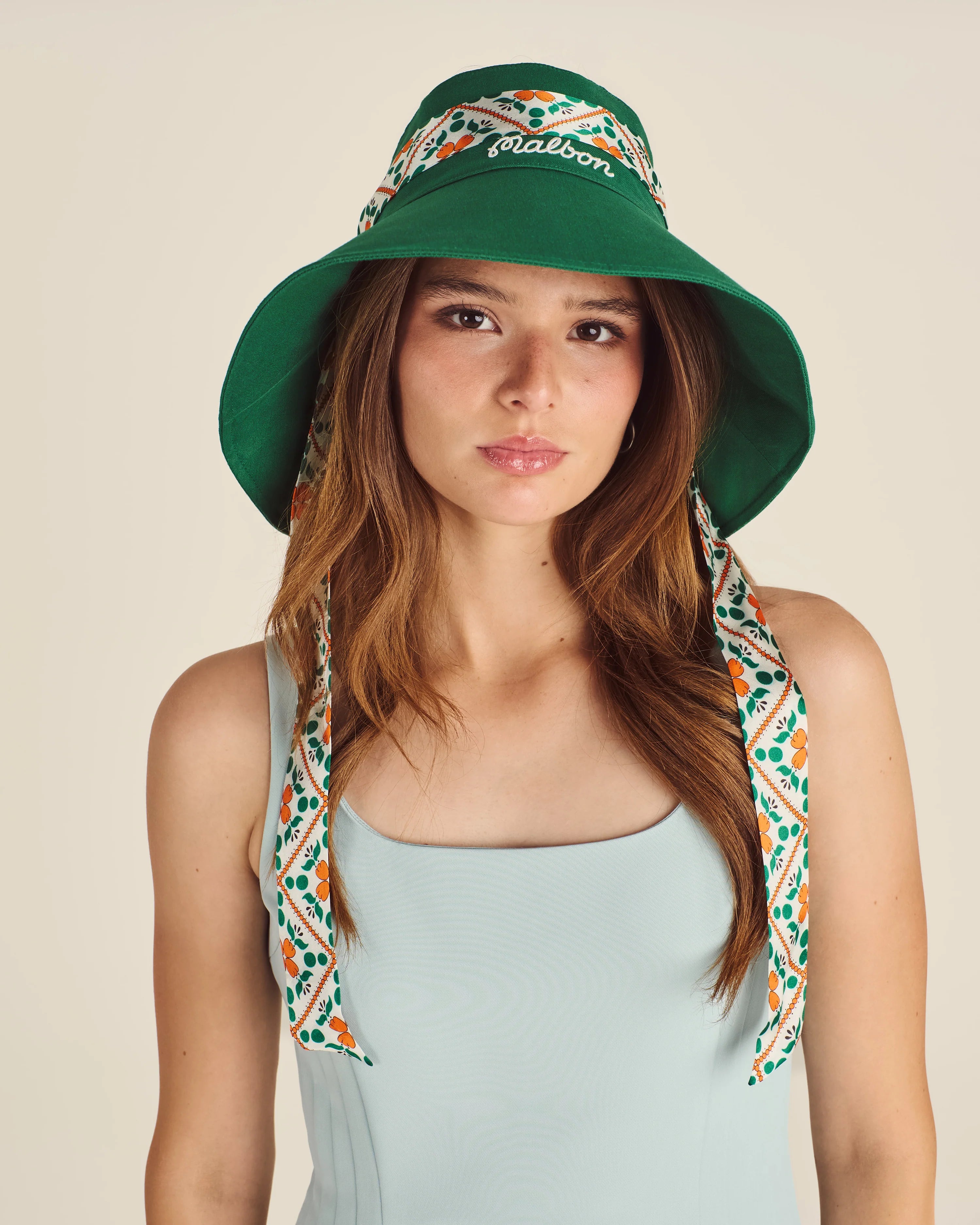 Malbon Golf | Gia Open Top Bucket Hat in green on model at Gallery Streetwear Kelowna BC Canada