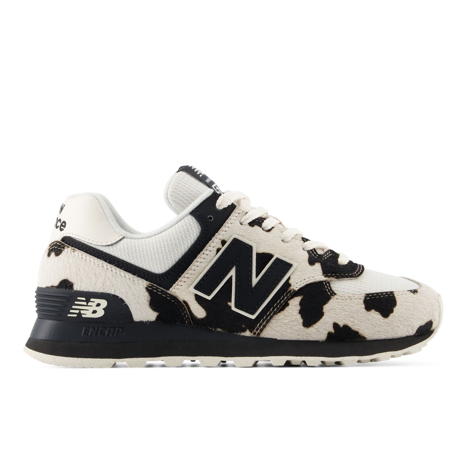 New Balance Women's 574 cow print sneaker in black and cream calf hair, lateral side view